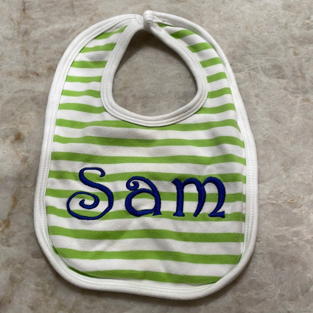 Baby bib with “Sam” monogram